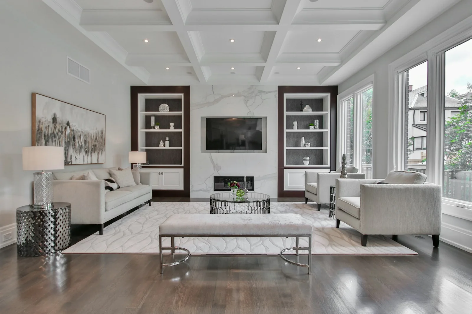Living room interior design with coffered ceiling and built-in shelving in Pune